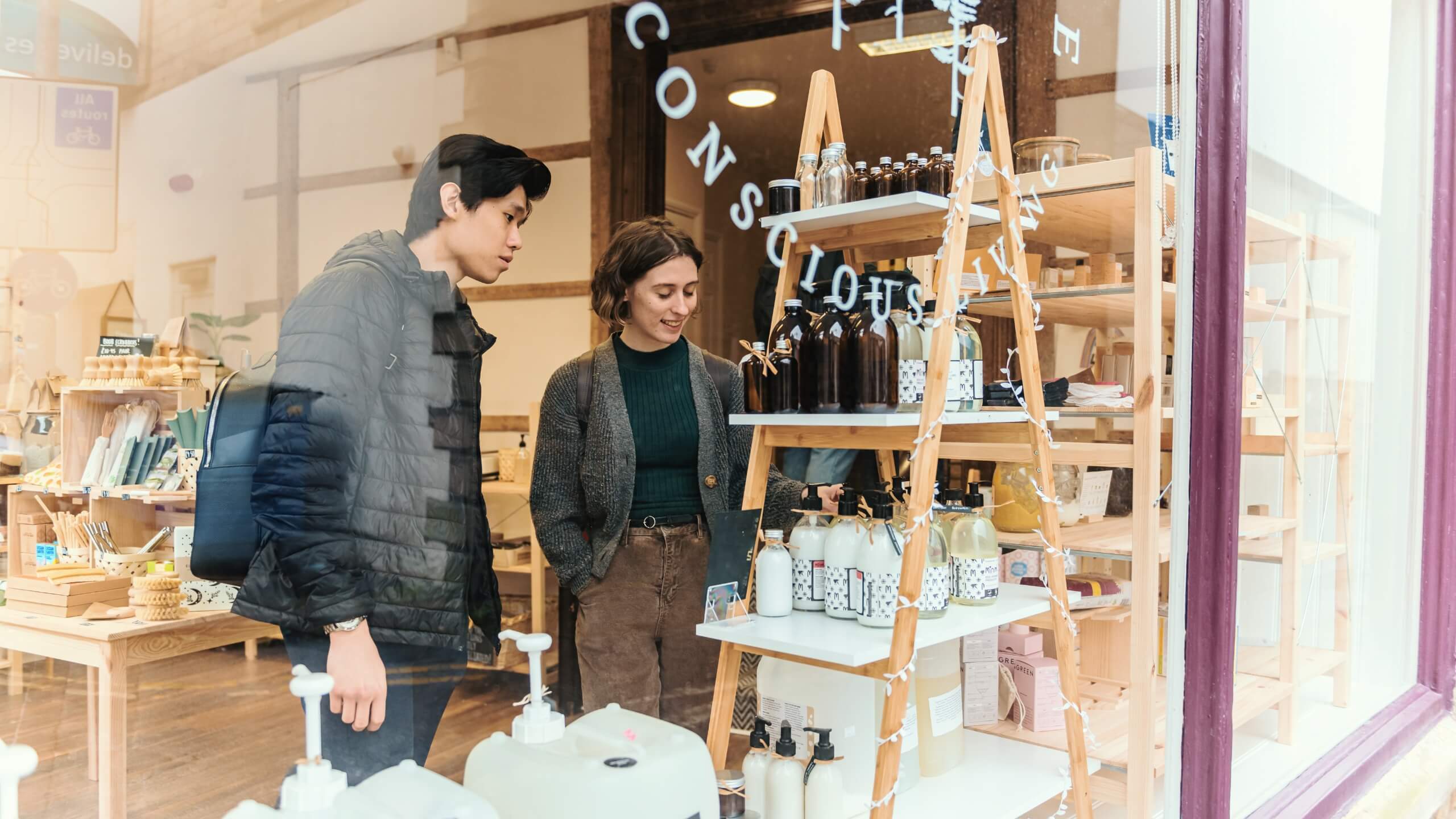 Two students look at items in an independent boutique.